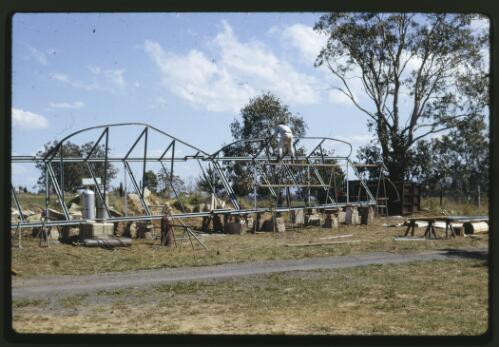 Construction and installation of the Tom Bass lintel sculpture for the National Library of Australia, Canberra, 1967-1969 [transparency] / Kevin Goodridge