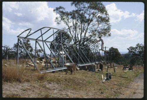 The Tom Bass lintel sculpture under construction for the National Library of Australia, Minto, New South Wales, October 1967, 2 [transparency] / Kevin Goodridge