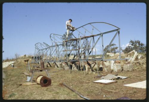 The Tom Bass lintel sculpture under construction for the National Library of Australia, Minto, New South Wales, October 1967, 3 [transparency] / Kevin Goodridge