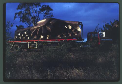 Transporting the Tom Bass lintel sculpture by truck to the National Library of Australia, Minto, New South Wales, July 1968, 4 [transparency] / Kevin Goodridge