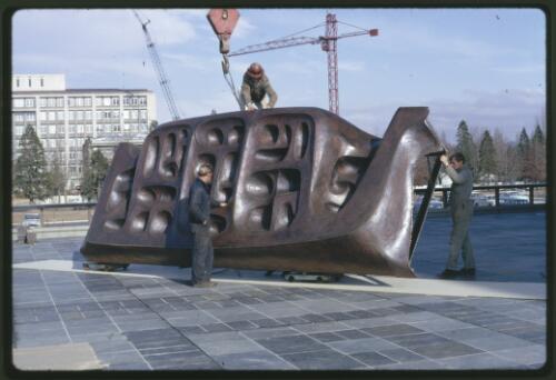Moving the Tom Bass lintel sculpture onto the podium by crane at the National Library of Australia, Canberra, Australian Capital Territory, July 1968, 7 [transparency] / Kevin Goodridge