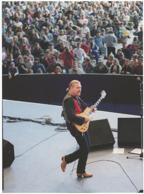 Billy Thorpe playing to the crowd at Myer Music Bowl, Melbourne, 13 November 1994 [picture] / Bruce Postle
