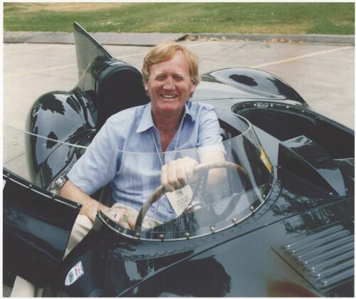 Ron Walker, head of the Australian Grand Prix Corporation, posing for a photograph in a car at a practice day during the 1997 Formula One Grand Prix, Albert Park, Melbourne, March 1997 [picture] / Bruce Postle