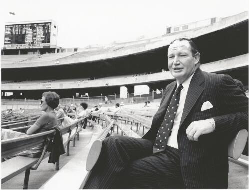 Kerry Packer sitting in the stands during the final day of the 1978-79 season First Test in Melbourne, Australia versus Pakistan, at the Melbourne Cricket Ground, Victoria, 15 March 1979 [picture] / Bruce Postle