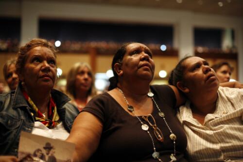 Louise, Marjorie and Sylvia, part of the Stolen Generation holding a photograph of their parents as Prime Minister Kevin Rudd delivers the Apology to the Stolen Generations at Parliament House, Canberra, 13 February 2008 [picture] / Louise Whelan