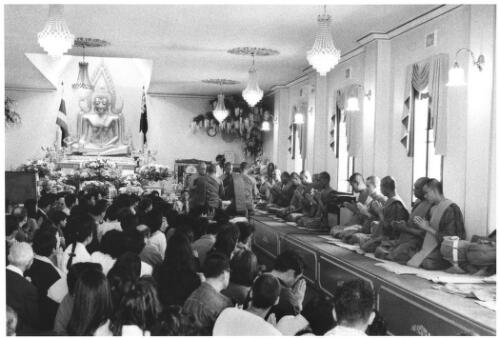 People gathered to give offerings to monks and receive their blessings, Kitani ceremony, Prayer Hall of Wat  Buddharangsee (Thai Buddhist temple), Trafalga Road, Annandale, Sydney, 27 October 2002 [picture] / Philip Gostelow