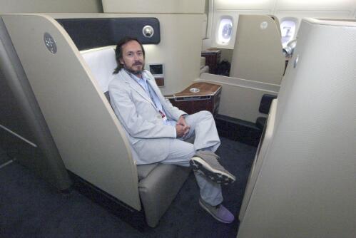 Industrial designer Marc Newson sits in the Qantas A380 First Suite class, Sydney, 21 September 2008 [picture] / Robert James Wallace