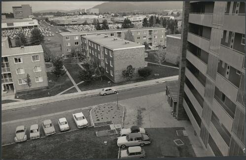 View of apartment blocks, parking areas and shops in Canberra city, ca. 1960 [picture] / Jeff Carter