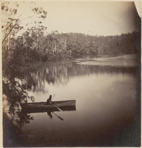 Man seated in a canoe, wearing a top hat, on a body of water in New South Wales, ca. 1869 [picture] / Charles Walter