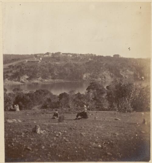 Two men sitting on the ground with a river in the background, New South Wales, ca. 1869 [picture] / Charles Walter