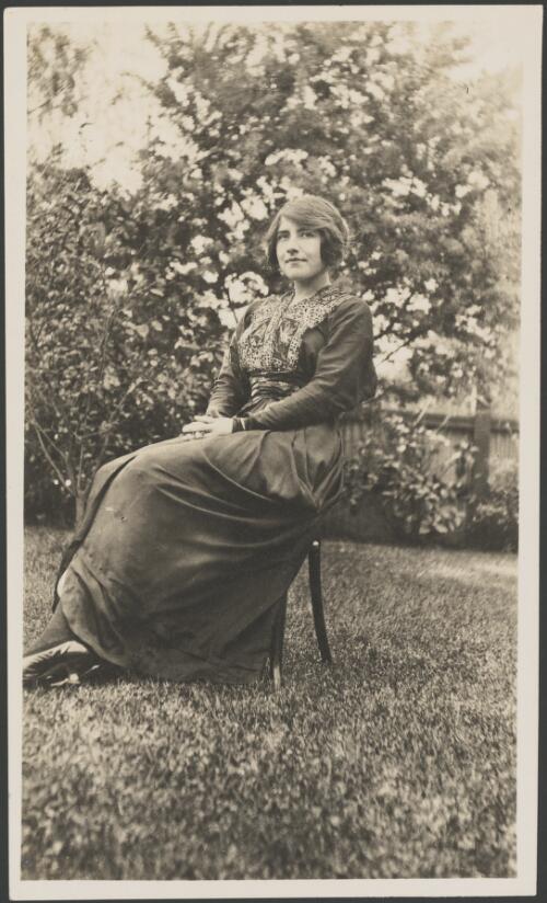 Portrait of Molly Fink sitting in a garden, ca. 1915 [picture]