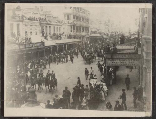Larry Foley's White Horse Hotel in George Street, Sydney, with the Sudan regiment passing by [picture]