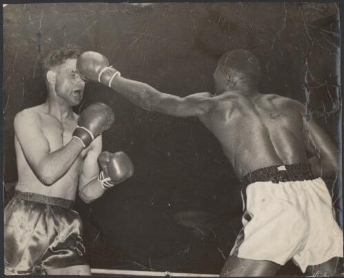 Jack Hassen and Joe Brown during a boxing match at West Melbourne Stadium, Melbourne, 22 September 1950 [picture]