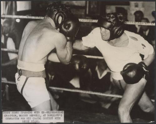 Tommy Burns sparring with ex-welterweight champion, Hockey Bennell, at Dunleavy's gymnasium for his coming contest with Benny Evans [picture]