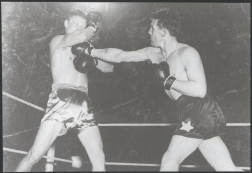 Kev Delaney on left and an unidentified boxer during a boxing match [picture]