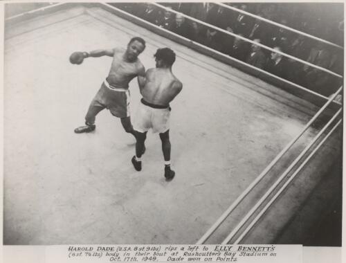 Herold Dade rips a left to Elley Bennett's body in their bout at Rushcutters Bay Stadium, New South Wales, October 17th 1949 [picture]