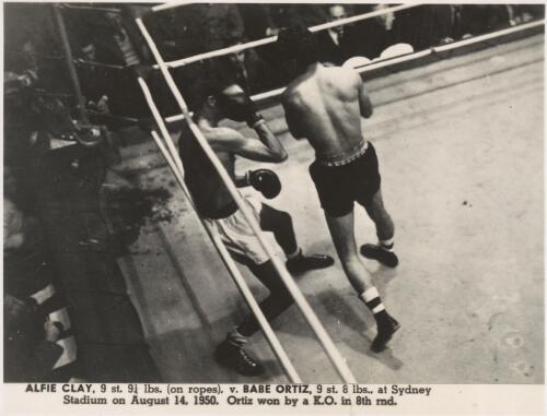 Alfie Clay, 9 st. 9 1/4 lbs. (on ropes), versus Babe Ortiz, 9 st. 8 lbs., at Sydney Stadium on August 14, 1950 [picture]