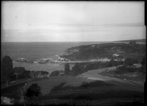 View of Twofold Bay showing road to Eden Wharf in foreground and the Lookout, with Eden in middle distance, ca. 1940 [picture]