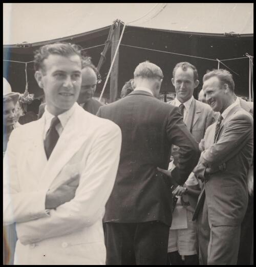 Prince Philip talks to Tom Meigan and Bob Richmond during the Queen's Garden Party at the Cocos Islands, April 1954, John Clunies Ross in foreground [picture]