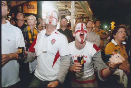 Two English fans amongst the crowd at the Rocks cheer while watching the live broadcast of the Rugby World Cup final Sydney, November 2003 [picture] / Ben Rushton