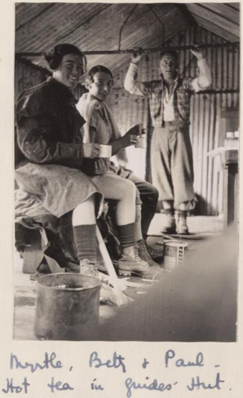 Myrtle Maclagan, Betty Snowball, and Paul, having hot tea in the Guide's Hut, New Zealand, 1935 [picture]