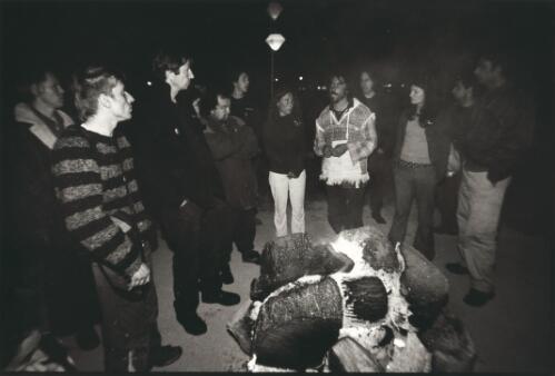 Victorian Socialist Party protesters beside the campfire at the Aboriginal Tent Embassy the night before US President Bush arrives in Canberra, 22 October, 2003 [picture] / Ben Rushton