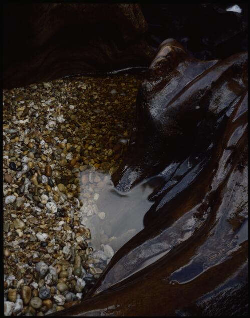 Pebbles and pothole, Denison River, Tasmania, 1979 [transparency] / Peter Dombrovskis