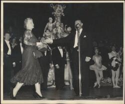 Lady Tait walking onstage and compere Terry Dear at the microphone ... pic