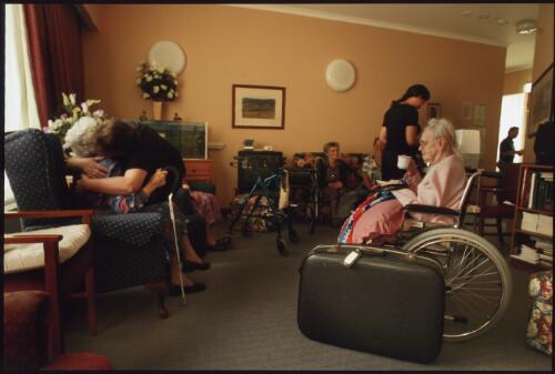 Residents of the Omeo hospital and nursing home drink cups of tea before being evacuated to safer ground, whilst the town waited day after day for the fire to arrive on their doorstep [picture] / Simon O'Dwyer