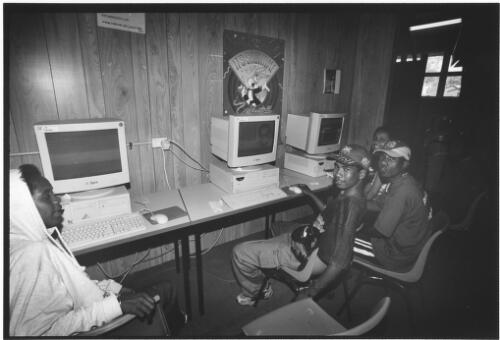 [East Timorese refugees in the computer room], East Hills Army Base, New South Wales, October 1999 [picture] / John Immig