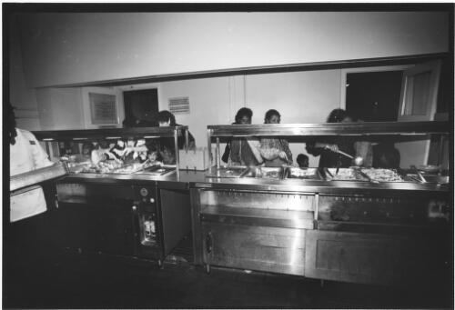 [East Timorese refugees getting food in the kitchen], East Hills Army Base, New South Wales, October 1999 [picture] / John Immig