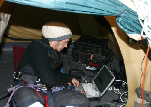 Jarek in the communications equipment tent of the Global Rescue Station Tree, Styx Valley, Tasmania [picture] / June Orford