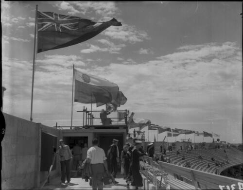 Flags of the world flying around the perimeter of the stands at the Olympic Games, Melbourne, 22 November 1956 [picture]