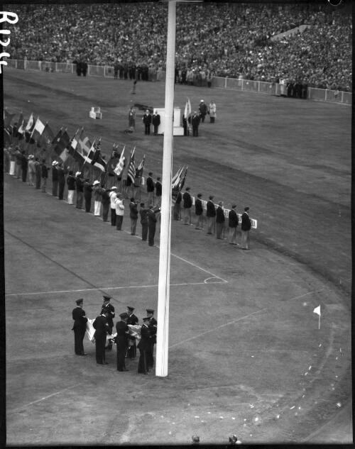 The lowering of the Olympic flag as part of the closing ceremony, Olympic Games, Melbourne, 8 December 1956 [picture]