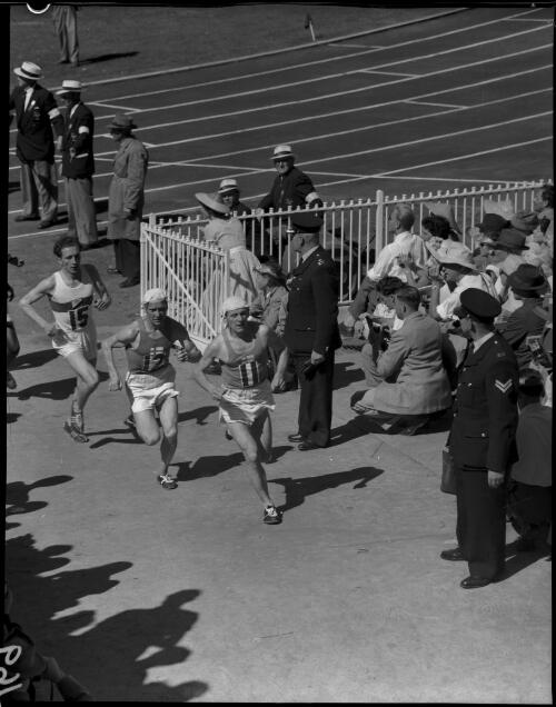 Marathon runners leaving the stadium, being led by two Finns, no. 11 Karvonen (Finland) and no. 12 (Finland), Olympic Games, Melbourne, 1 December 1956 [picture]