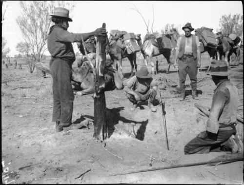 Expedition members stopping at a deep well before Vaughan Springs, Northern Territory, 1932 [picture] / Michael Terry
