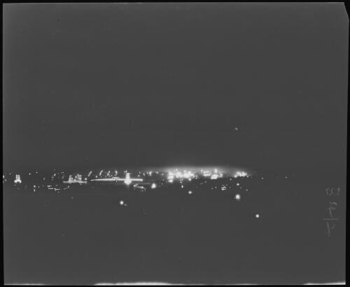 HMAS Sydney and the city illuminated at night during the Royal visit, Sydney Harbour, June 1920 / Michael Terry