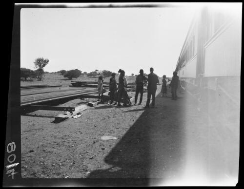 Aboriginal Australians beside a train on the Trans Australian Railway, Nullabor Plain, South Australia, 1923 / Michael Terry