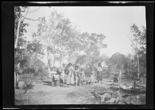 Five Aboriginal women and a young Aboriginal girl at a campsite, Northern Territory, approximately 1927 / Michael Terry