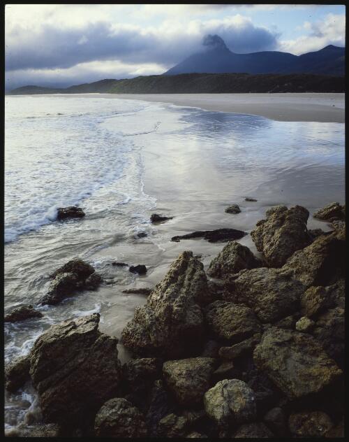 Precipitous Bluff from Prion Beach, southwest Tasmania, 1984 [transparency] / Peter Dombrovskis