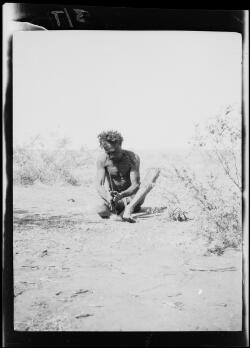 Aboriginal Australian man making fire with a stick, Billiluna Pool ...