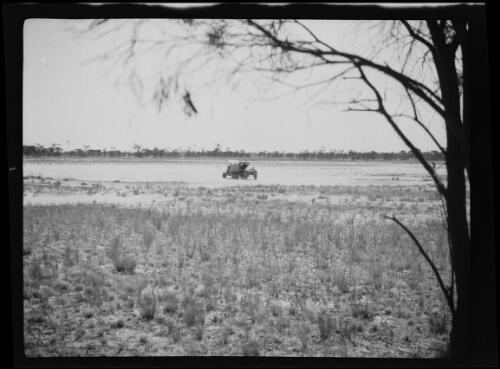 Distant view of an expedition vehicle and trailer, Western Australia, 1925 / Michael Terry