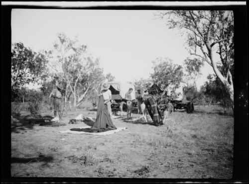 Four men packing up camp equipment, Western Australia, approximately 1923 / Michael Terry