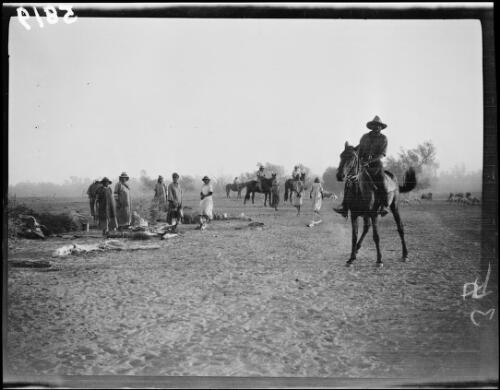 Aboriginal stockmen on horses in the company of their family, Northern Territory, 1928 / Michael Terry