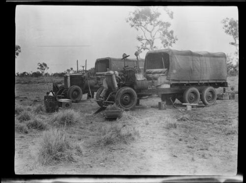 Keyser checking the engine of one of the Morris Commercial trucks, Soakage Creek, Northern Territory, 1928 / Michael Terry