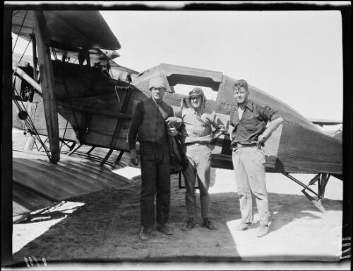 Michael Terry, pilot Woods and Leslie Birks standing in front of a Bristol F.2 Fighter aeroplane, Wallal Downs, Western Australia, 1928 / Michael Terry