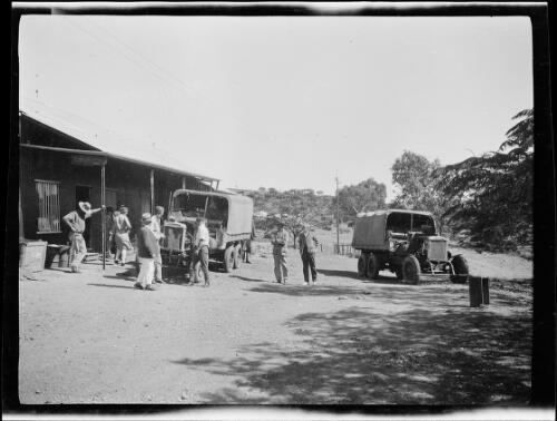 A group of people surrounding one of the expedition's Morris Commercial truck, Hall Creeks, Western Australia, 1928 / Michael Terry