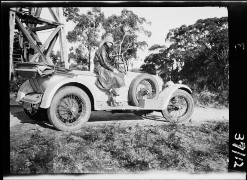 Woman seated on parked motor vehicle, Arthurs Seat, Victoria, 3 May 1929 / Michael Terry