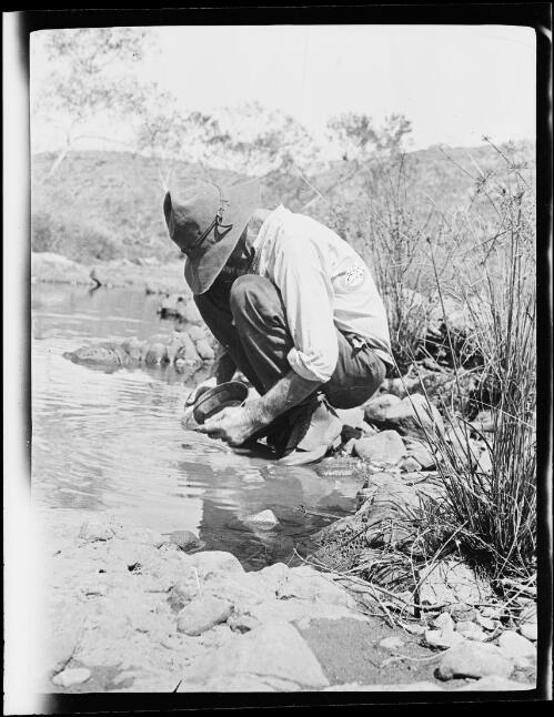 Michael Terry panning for gold, Central Australia?, approximately 1930