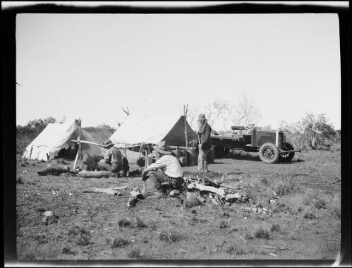 Three expedition members and a Morris Commercial truck at a campsite, Central Australia?, approximately 1930 / Michael Terry
